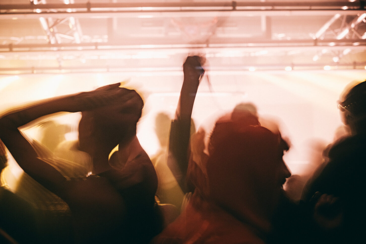 Long exposure image of people dancing vigorously at Sustain-Release.