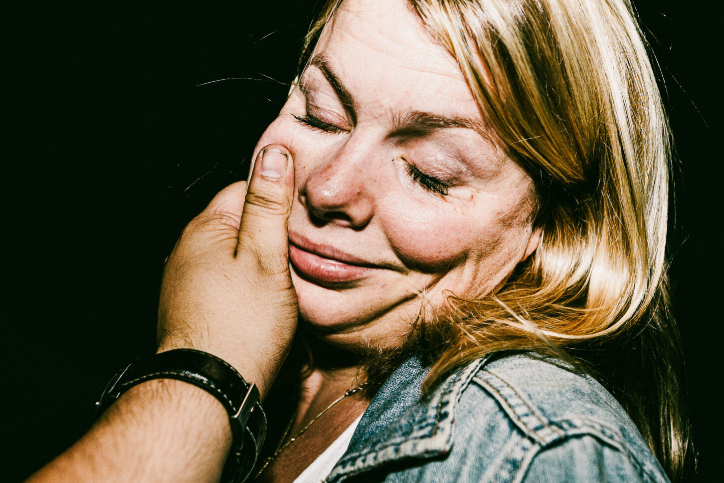 Close-up, raw portrait of a subject with a look of pure surprise, highlighting the high-energy and candid nature of the 'Cheeky Bastards' collection.